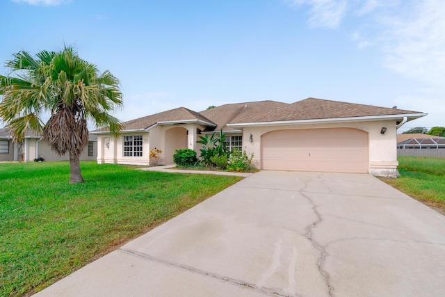 view of front facade featuring a front yard and a garage