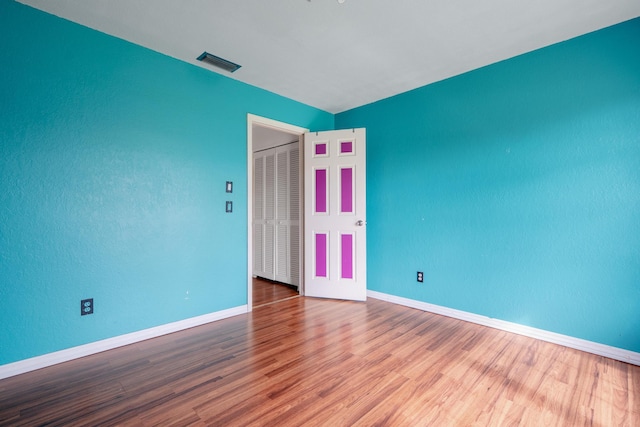 unfurnished room featuring hardwood / wood-style floors