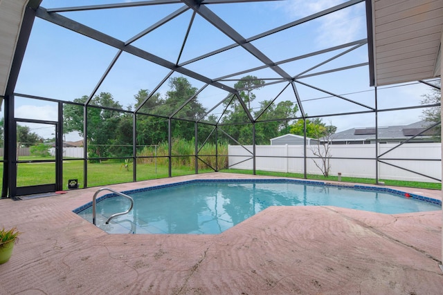 view of swimming pool featuring glass enclosure, a lawn, and a patio