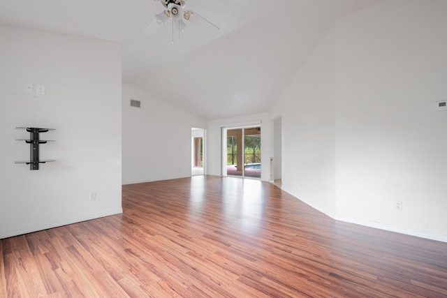 unfurnished room featuring light wood-type flooring, lofted ceiling, and ceiling fan