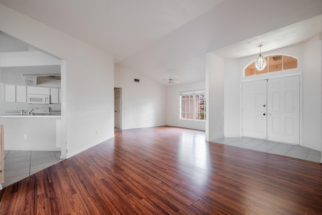 foyer entrance with high vaulted ceiling, light hardwood / wood-style flooring, and ceiling fan