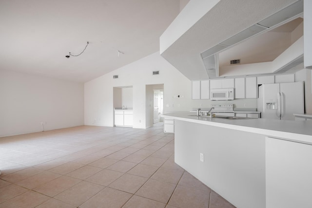 kitchen featuring white appliances, sink, high vaulted ceiling, white cabinets, and light tile patterned flooring