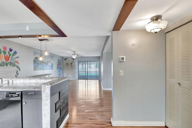 kitchen with ceiling fan, wood-type flooring, black dishwasher, and hanging light fixtures