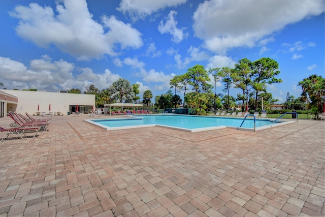 view of swimming pool featuring a patio area