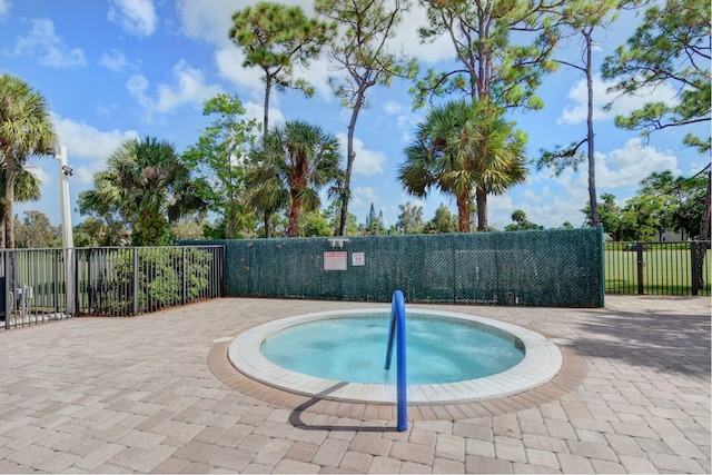 view of pool featuring a hot tub