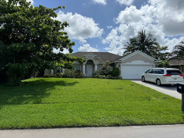 view of front facade with a garage and a front yard