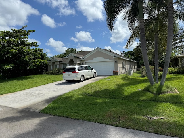 view of front of property with a garage and a front lawn