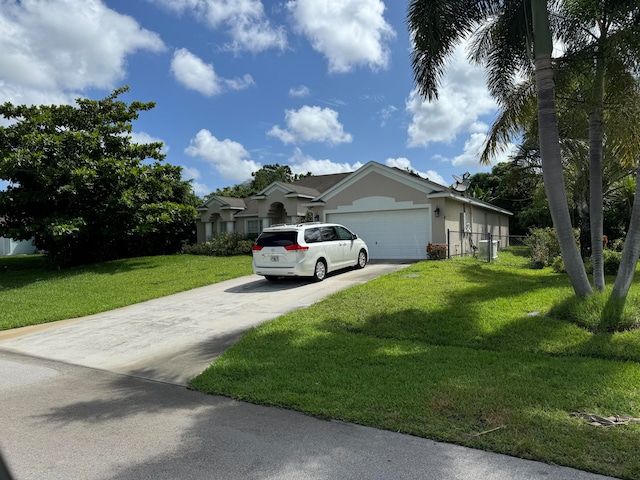 view of front of property with a garage and a front yard