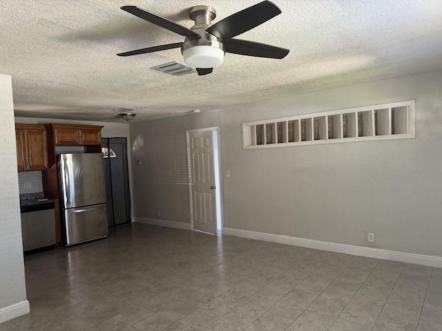 kitchen with ceiling fan, appliances with stainless steel finishes, and a textured ceiling