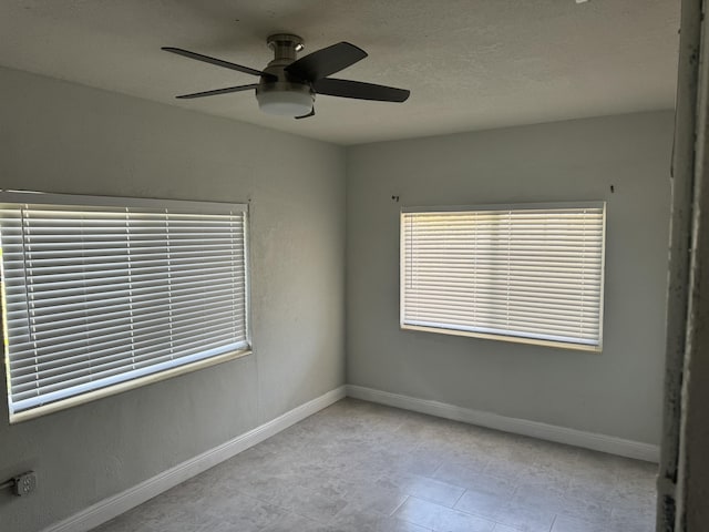 empty room featuring ceiling fan