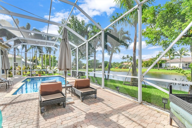 sunroom / solarium with a swimming pool and a water view