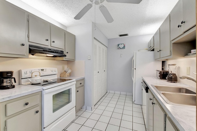 kitchen with white electric range oven, ceiling fan, sink, a textured ceiling, and light tile patterned floors