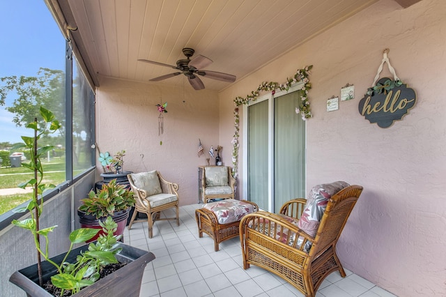 sunroom / solarium with wooden ceiling and ceiling fan