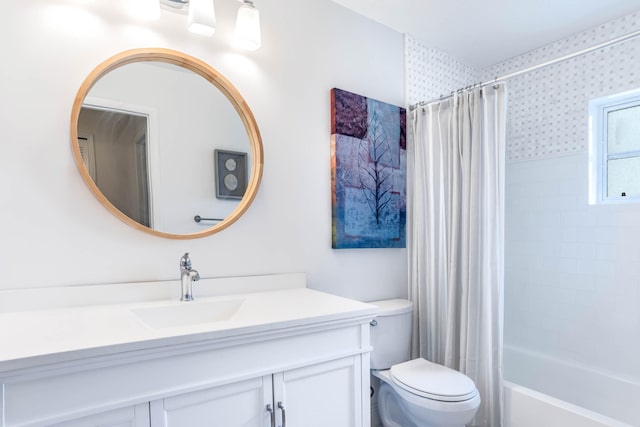 full bathroom featuring vanity, toilet, and shower / bath combination with curtain