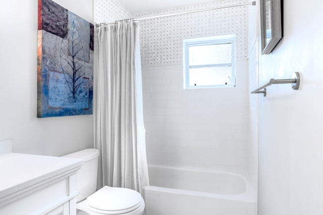 full bathroom featuring vanity, shower / tub combo with curtain, toilet, and a wealth of natural light