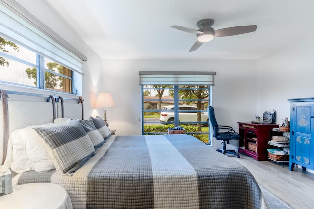 bedroom featuring hardwood / wood-style flooring and ceiling fan