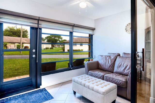 interior space with ceiling fan