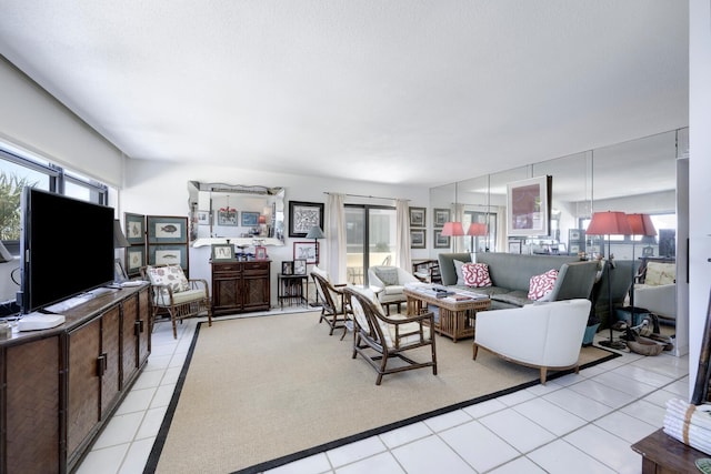 living room with light tile patterned floors and plenty of natural light