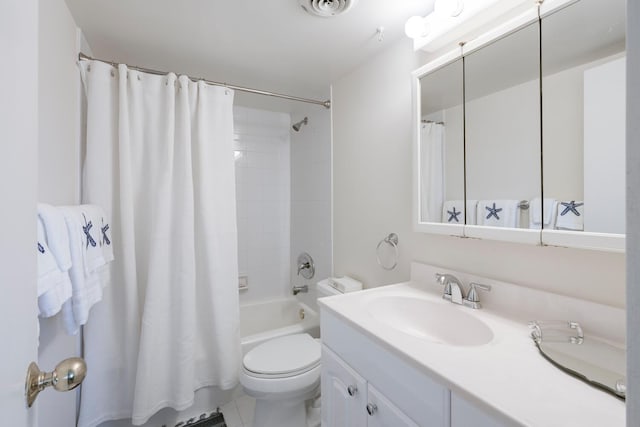 full bathroom featuring tile patterned floors, vanity, shower / bath combo with shower curtain, and toilet