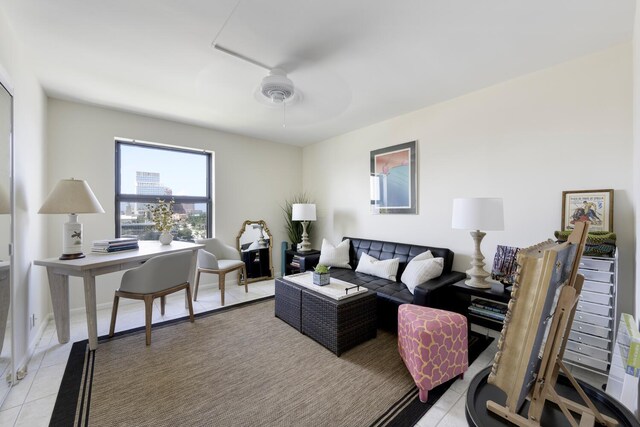 living room with ceiling fan and light tile patterned floors