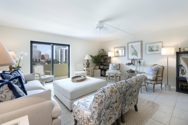 living room featuring light tile patterned floors and ceiling fan