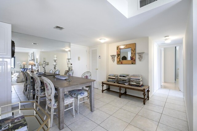 dining space with light tile patterned floors