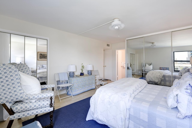 bedroom with light hardwood / wood-style flooring and ceiling fan