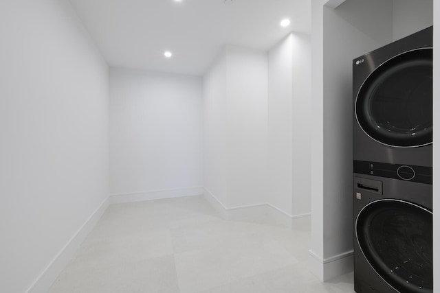 laundry room featuring stacked washing maching and dryer