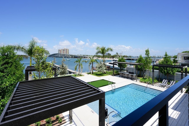 view of swimming pool featuring a water view