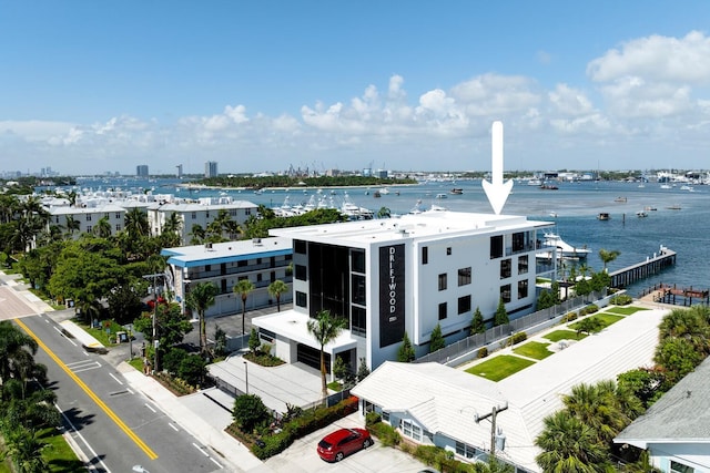 birds eye view of property with a water view