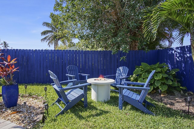 view of yard with an outdoor fire pit