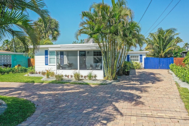 view of front of property with a sunroom