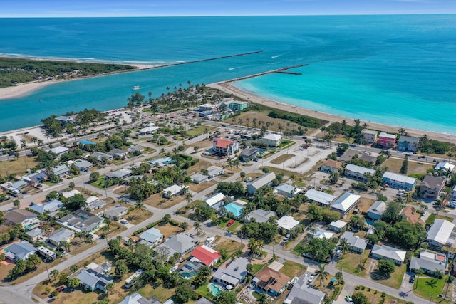 birds eye view of property featuring a water view and a view of the beach