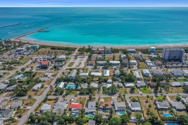 drone / aerial view with a view of the beach and a water view