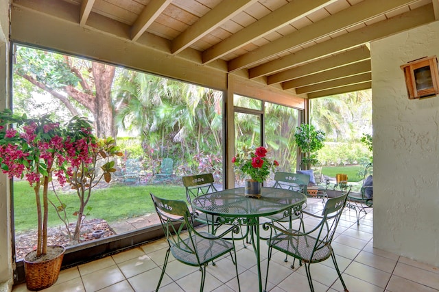 sunroom with beamed ceiling and wood ceiling