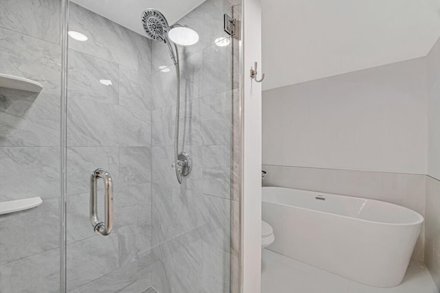 bathroom with separate shower and tub and toilet