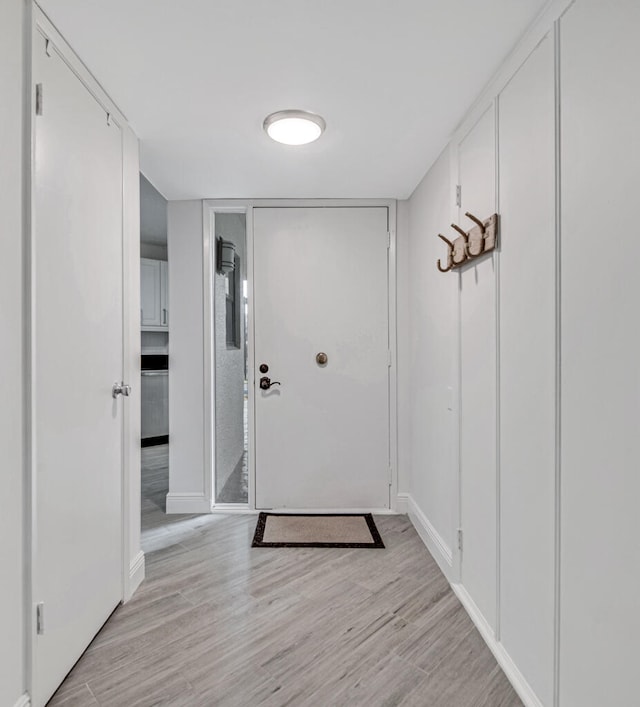 doorway to outside with light hardwood / wood-style flooring