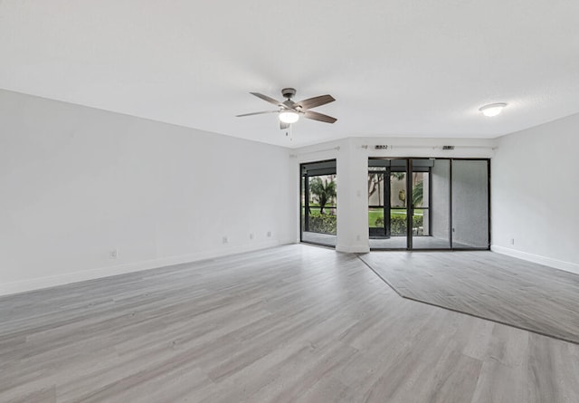 unfurnished room featuring ceiling fan and light hardwood / wood-style floors