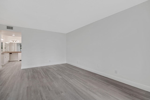 unfurnished room featuring light wood-type flooring