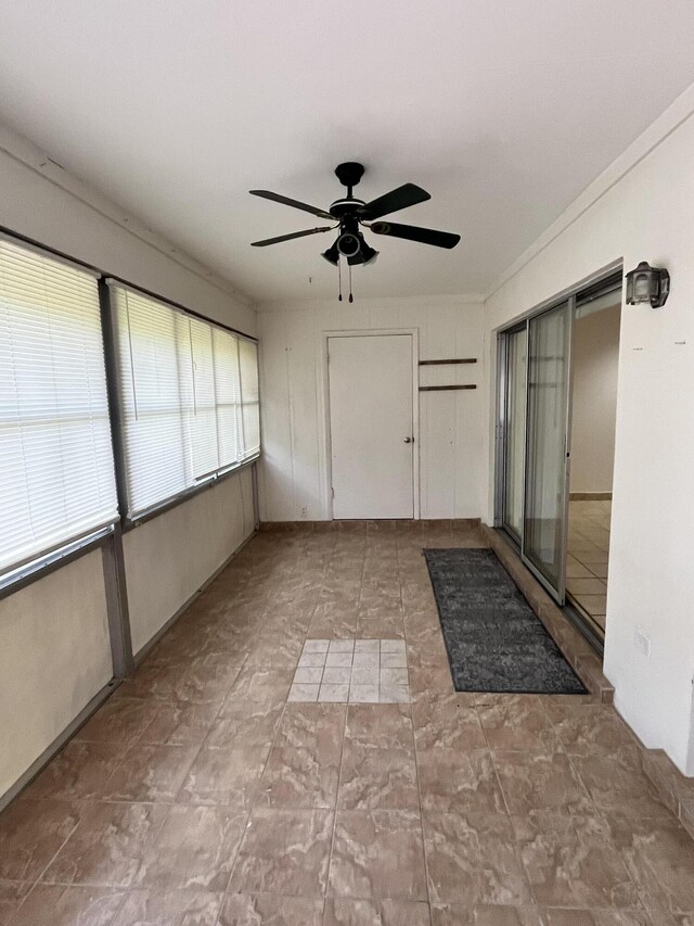 interior space featuring ceiling fan