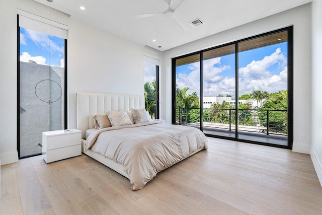 bedroom featuring access to exterior, light hardwood / wood-style flooring, and ceiling fan