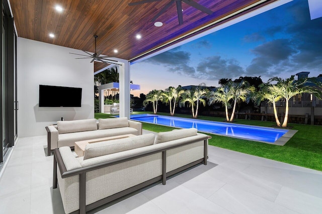 view of patio featuring a fenced in pool, outdoor lounge area, and ceiling fan