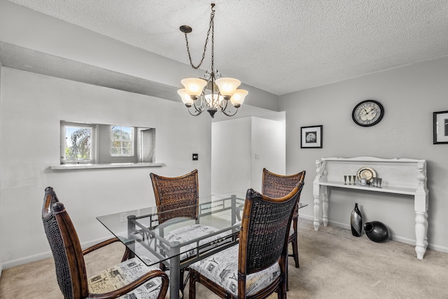 carpeted dining area with a textured ceiling, sink, and a notable chandelier