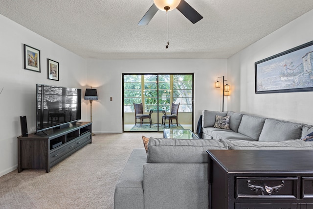 carpeted dining space with a notable chandelier and a textured ceiling