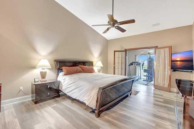 bedroom featuring ceiling fan, access to exterior, vaulted ceiling, and light hardwood / wood-style flooring