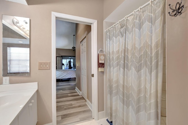 bathroom with vanity, hardwood / wood-style floors, and a shower with curtain