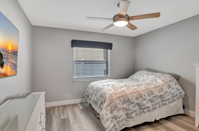 bedroom featuring light hardwood / wood-style floors and ceiling fan