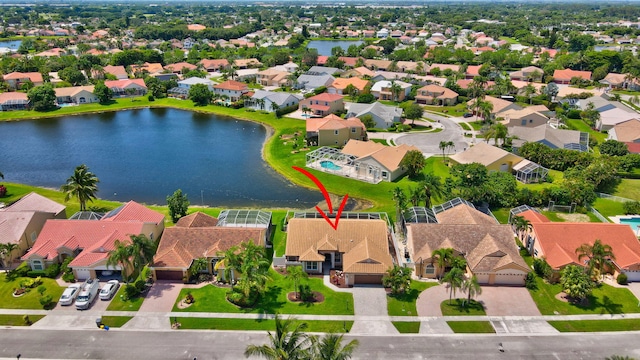 birds eye view of property featuring a water view