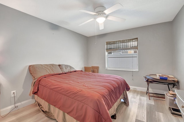 bedroom featuring ceiling fan and light wood-type flooring