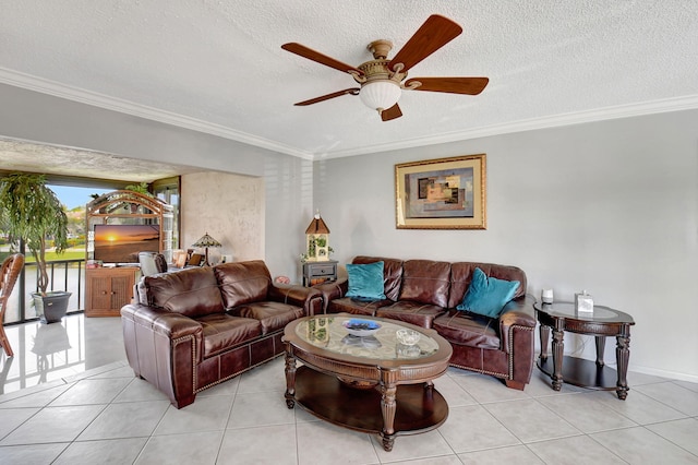 tiled living room featuring ceiling fan, a textured ceiling, and ornamental molding